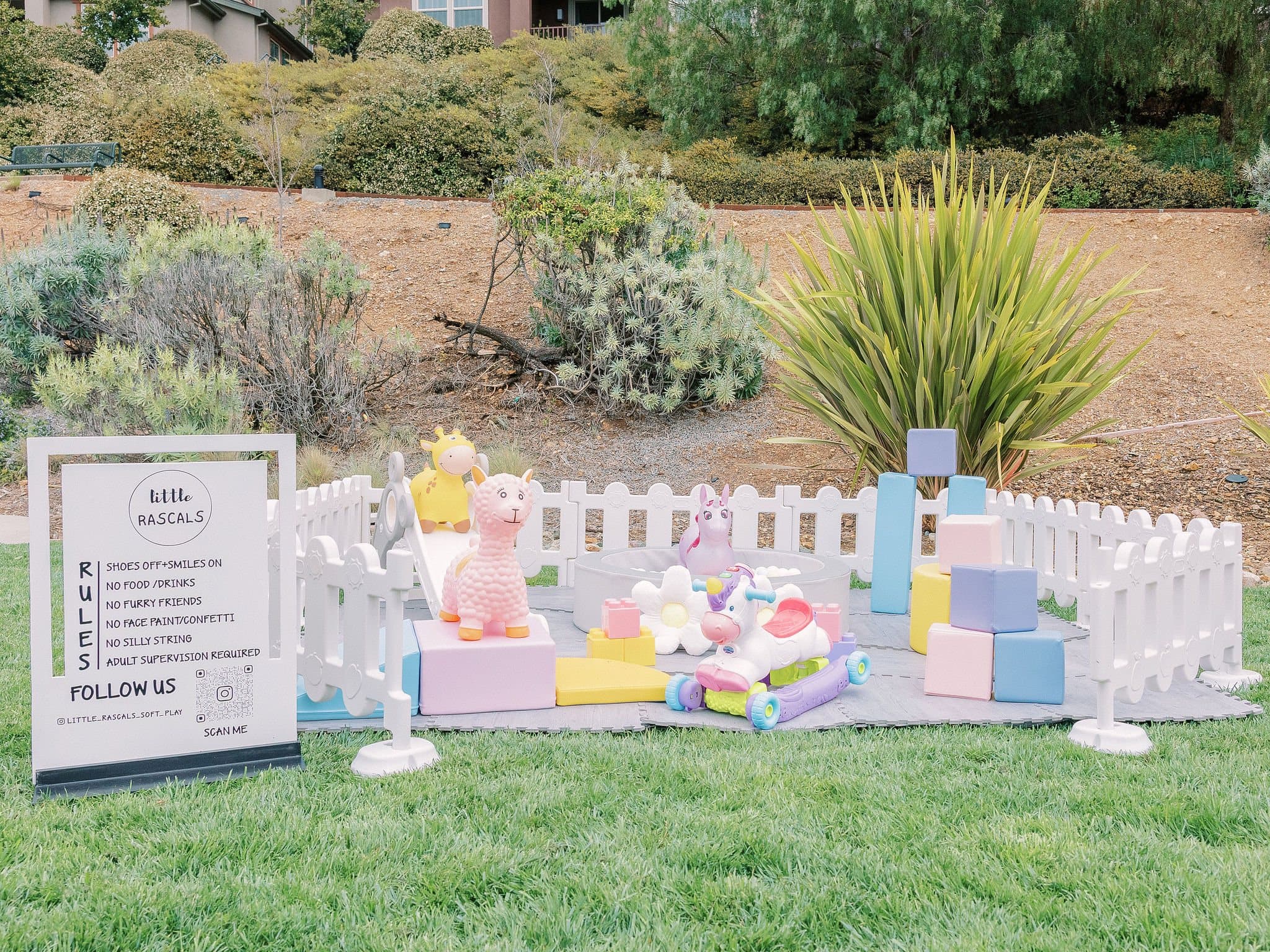Pastel soft play setup on a lawn